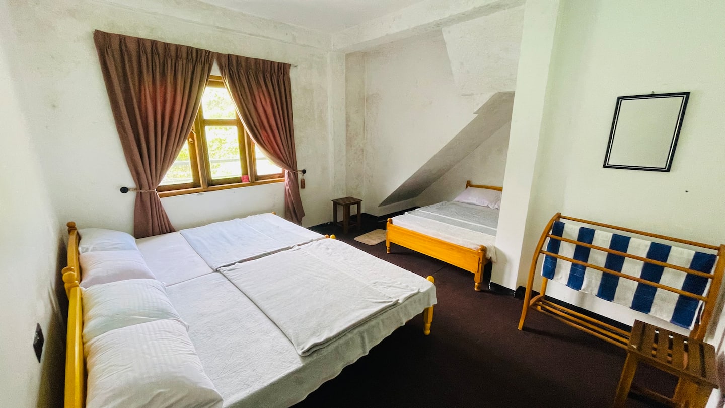 Carpeted bedrooms at Zonova Mist Guest House, Nuwara Eliya